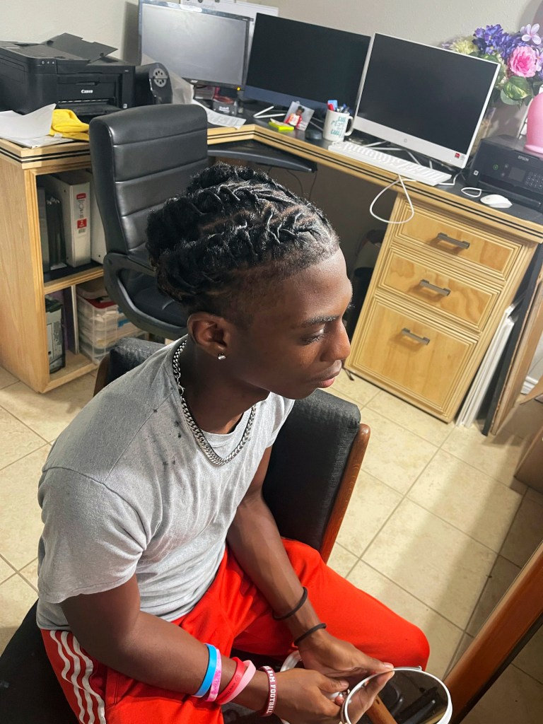 Darryl George's mother said he plans to go back to school, wearing his dreadlocks in a ponytail. 