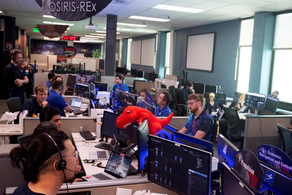 Team members monitor the capsule's operations during NASA's first major asteroid sample recovery rehearsal for its OSIRIS-REx 