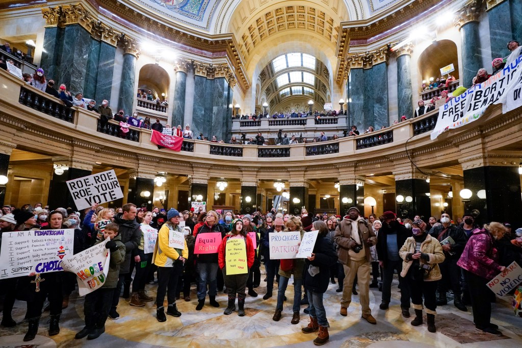Protesters are seen in the Wisconsin Capitol Rotunda during a march supporting overturning Wisconsin's near total ban on abortion